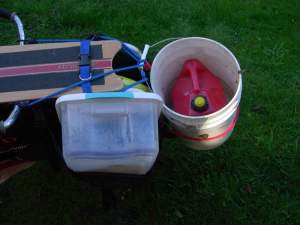 gallon of gas in a bucket on xtracycle